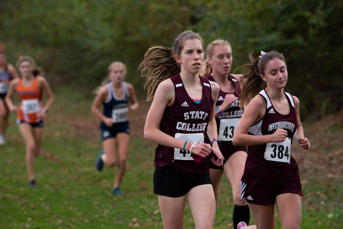 State College’s Jordan Reed (front) placed second at the Mid Penn cross country championships in Newville on Saturday. Karsyn Kane (behind Reed) placed eighth.
