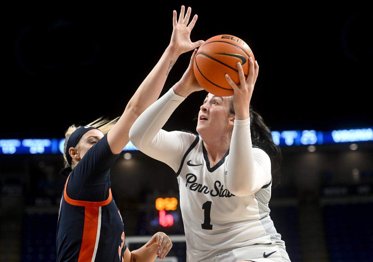 Penn State’s Ali Brigham looks to the basket around a Virginia defender during the game on Wednesday, Nov. 30, 2022.