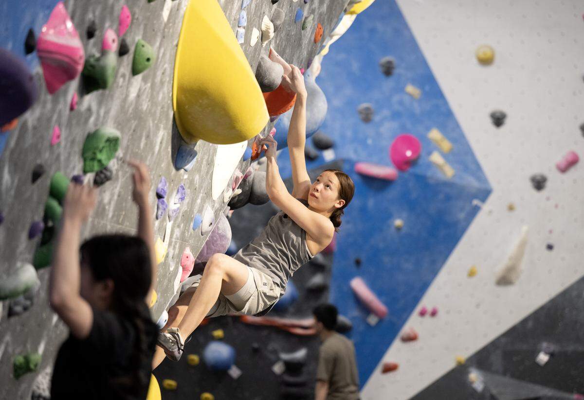 Hazel Pollock, 13, boulders at Climb Nittany on Thursday, May 14, 2026. 