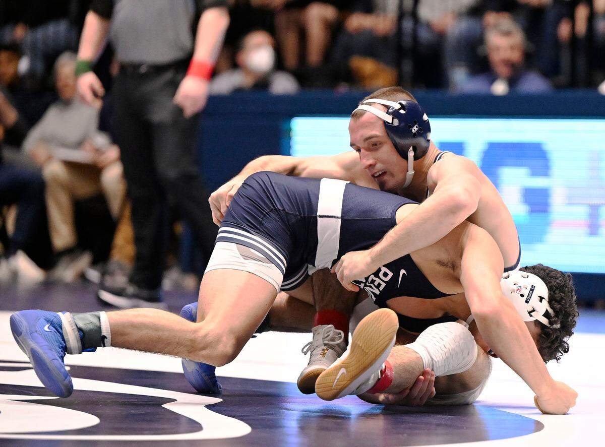 Clarion’s Seth Koleno fights off Penn State’s Beau Bartlett at 141 pounds Sunday at Rec Hall in State College. Bartlett defeated Koleno, 12-4. Penn State defeated Clarion 40-6. (For the CDT/Steve Manuel)