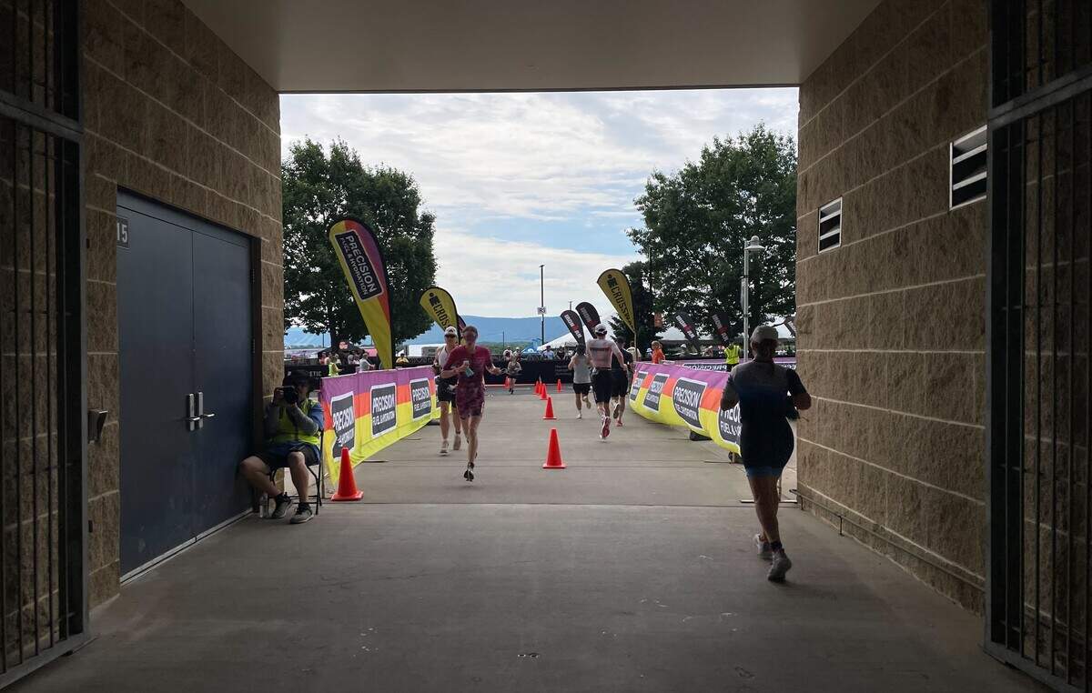 Participants run through part of Beaver Stadium on Sunday, June 14, 2026, at the Ironman 70.3 Pennsylvania Happy Valley North American Championship in Centre and Clinton counties.