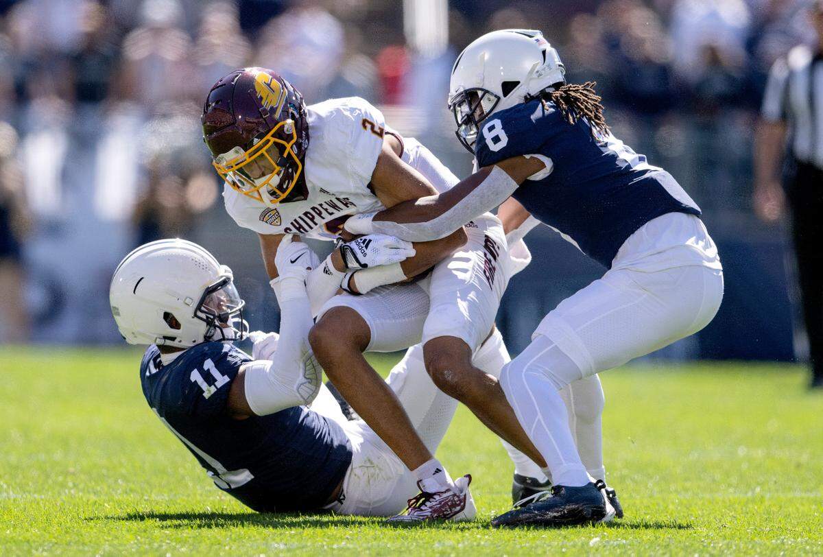 Penn State linebacker Abdul Carter and cornerback Marquis Wilson stop Central Michigan’s Carlos Carriere during the game on Saturday, Sept. 24, 2022.