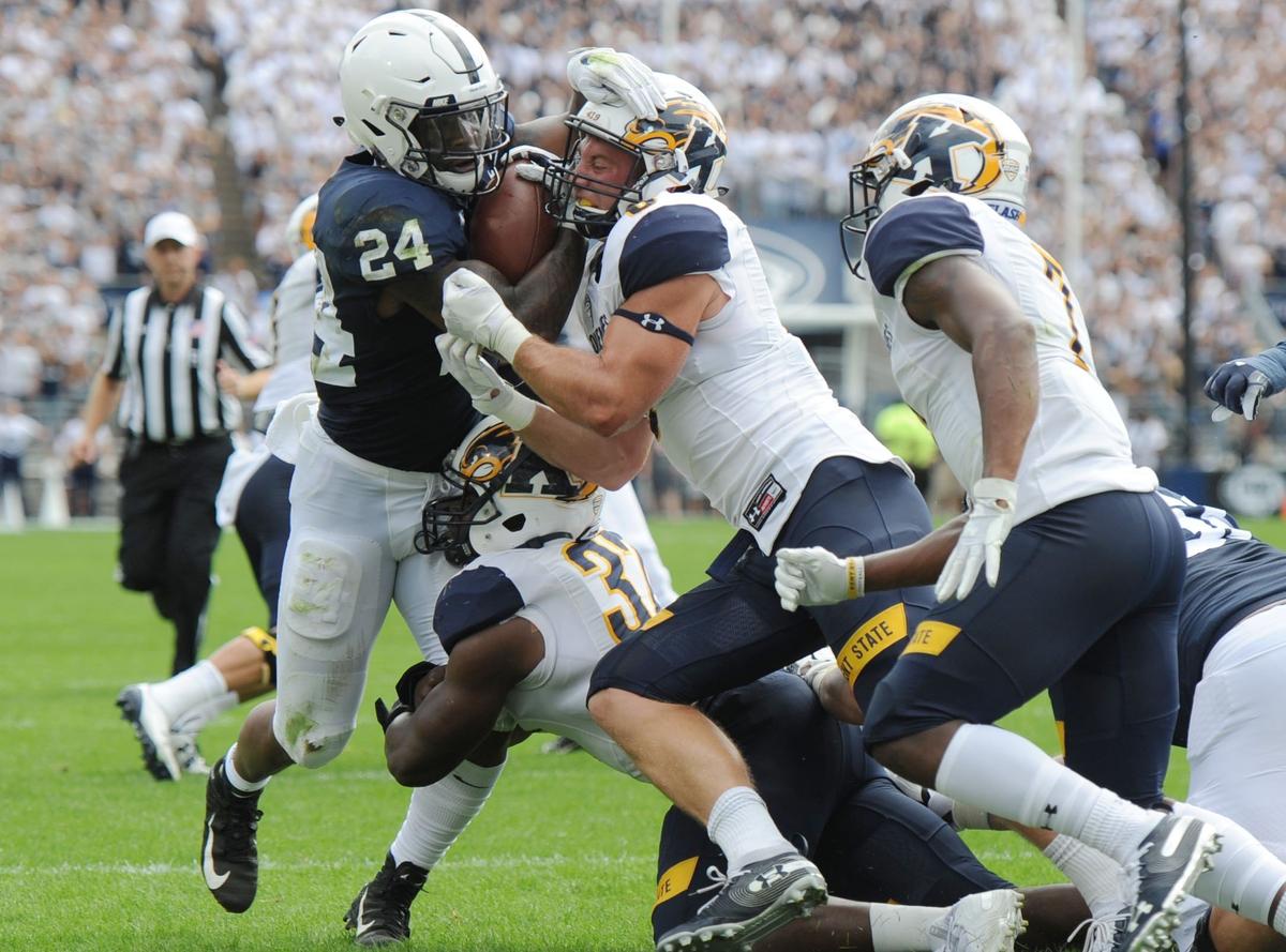 Penn State running back Miles Sanders gets tripped up during a game against Kent State Saturday, Sept. 15, 2018 at Beaver Stadium.