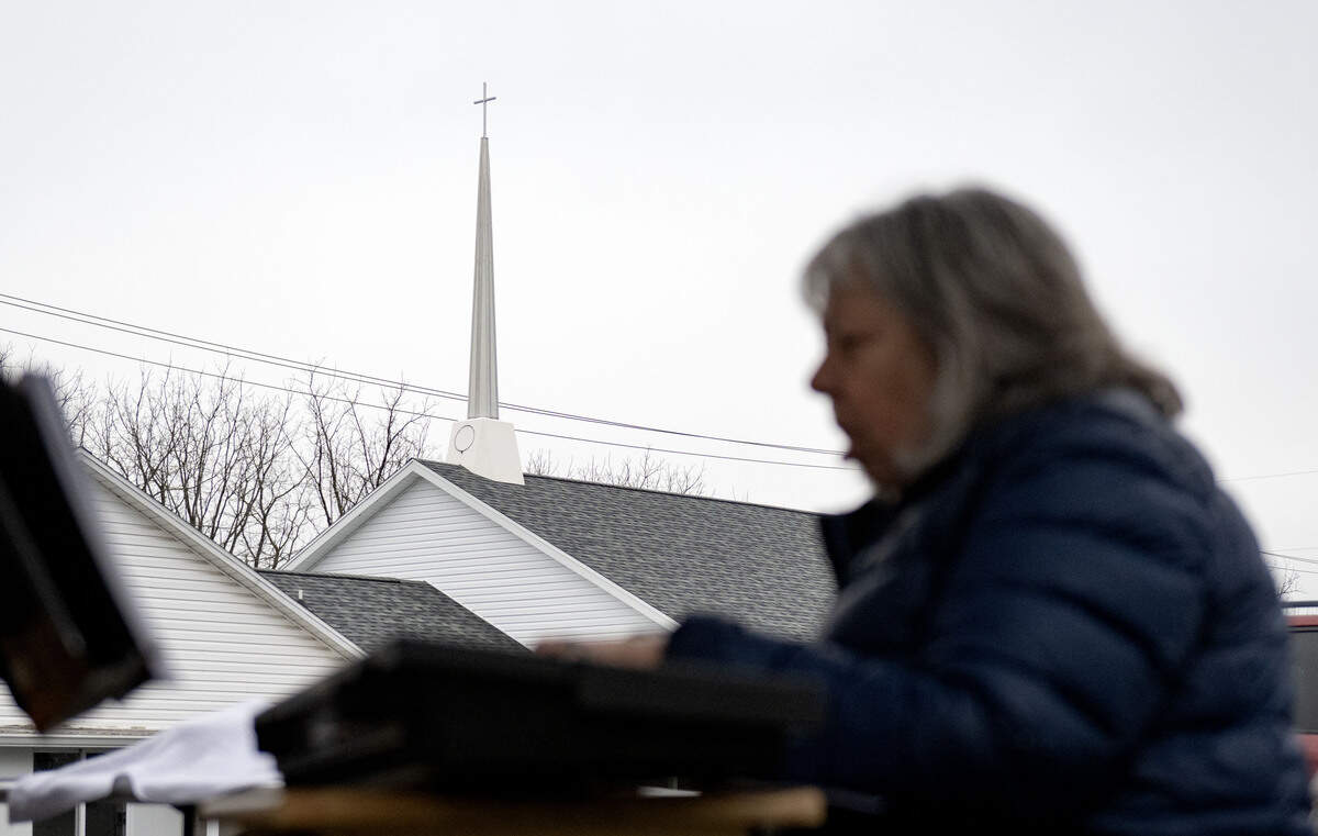 Debbie Romig plays a hymn to start the steeple blessing ceremony outside of Woodycrest United Methodist Church on Thursday, April 2, 2026.
