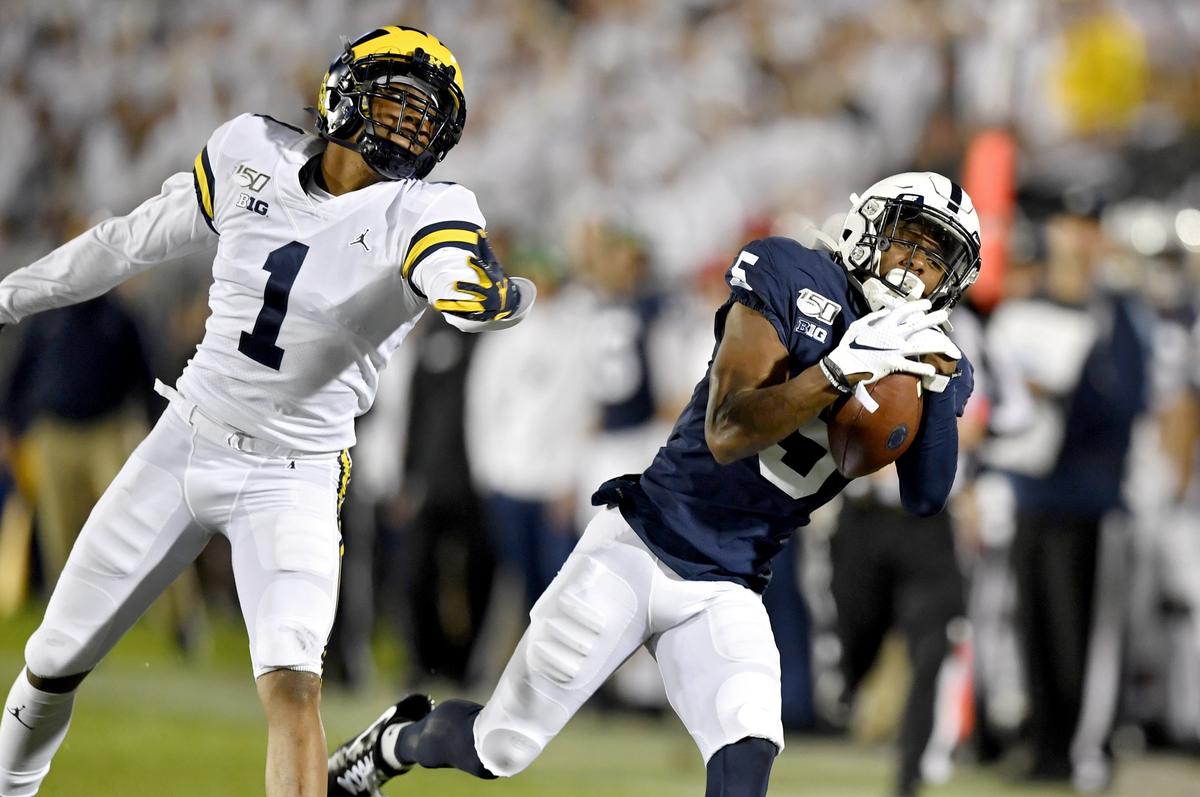 Penn State wide receiver Jahan Dotson makes a catch ahead of Michigan defensive back Ambry Thomas during the game on Saturday, Oct. 19, 2019.