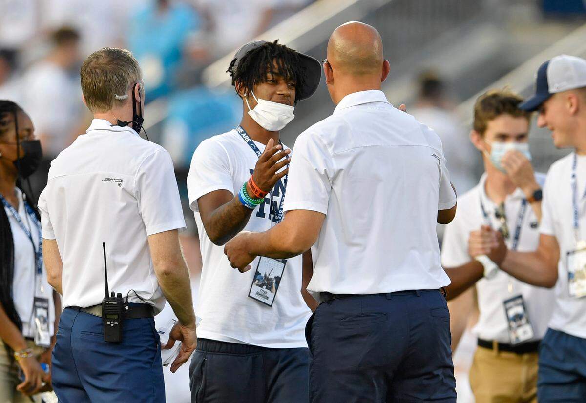 Recruit Tyler Johnson greets Penn State football coach James Franklin before the game against Auburn on Saturday, Sept. 18, 2021 at Beaver Stadium.