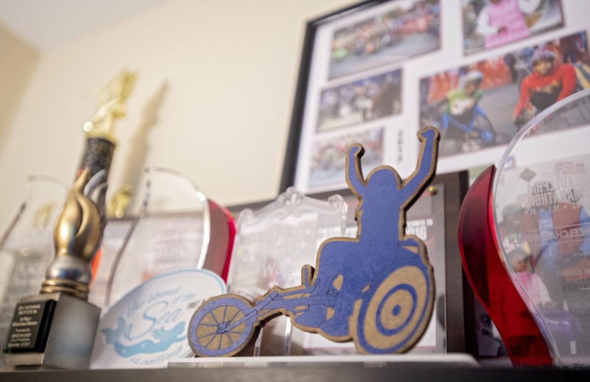 Michelle Wheeler’s 2018 First Place WC Open Women trophy sits proudly on a shelf of awards, medals and photos from her races.