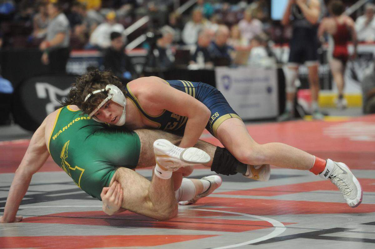 Bald Eagle Area’s Noah Foltz takes down Wyoming Area’s Connor Wrobleski in their 189-pound consolation second round match of the PIAA Class 2A Championships on Friday, March 11, 2022 at Giant Center in Hershey. Foltz beat Wrobleski, 7-1, to remain in contention for a PIAA medal.