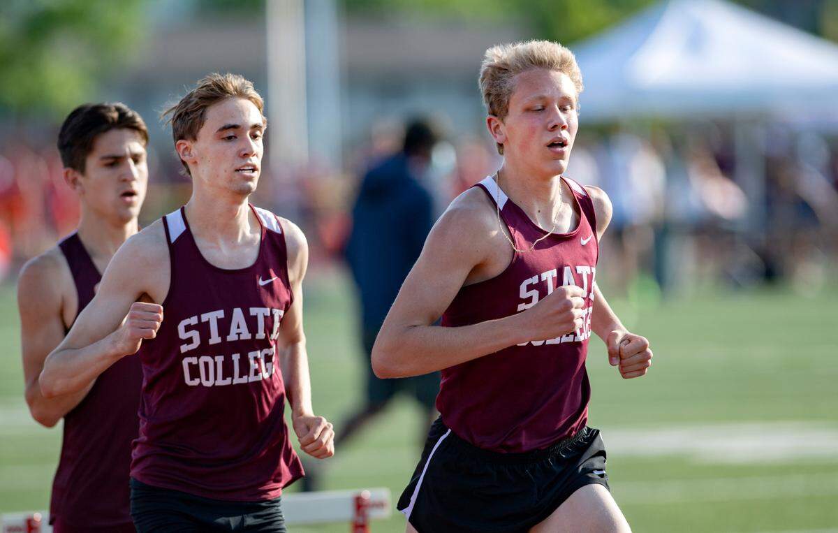 State CollegeÕs Brady Bigger and Trent Dinant in the 1600 meter run during the District 6 3A track and field championships at Mansion Park on Thursday, May 20, 2021.