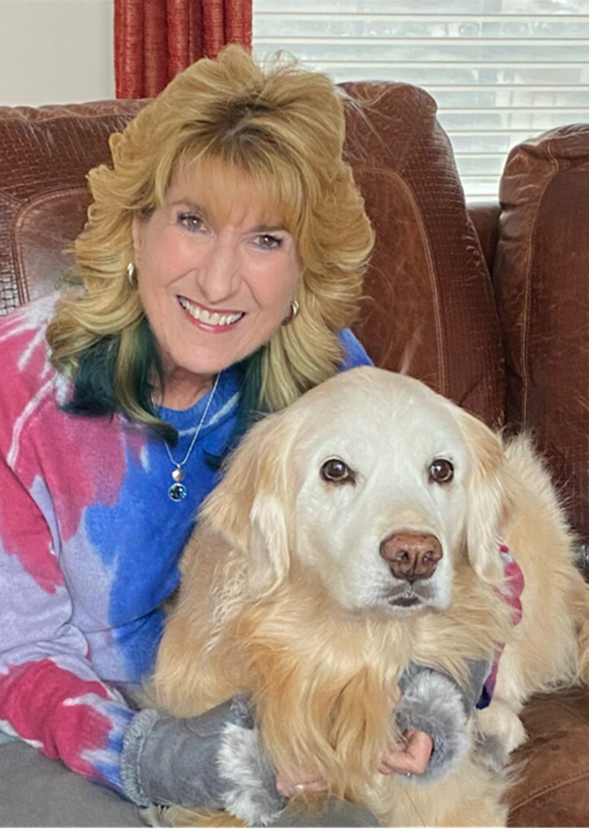JD Dunbar smiles with her beloved dog, Whiskey River.