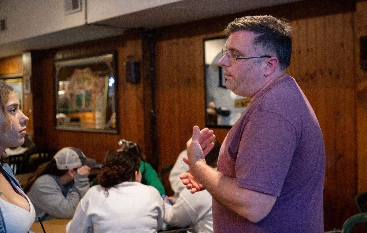 Robert Zeigler talks to a supporter during a thank you party he threw at Cafe 210 as he waited for election results on Tuesday, Nov. 8, 2022.