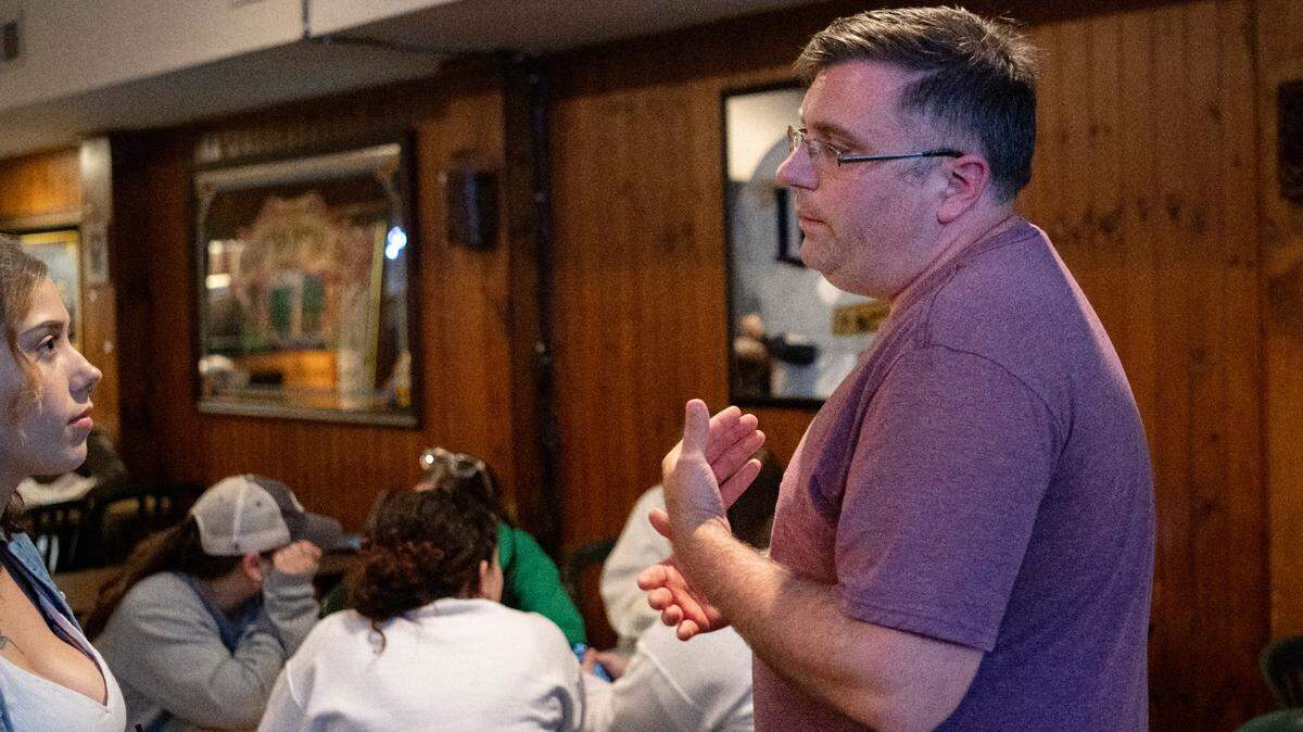 Rob Zeigler talks to a supporter during a thank you party he threw at Cafe 210 as he waited for election results on Tuesday, Nov. 8, 2022.