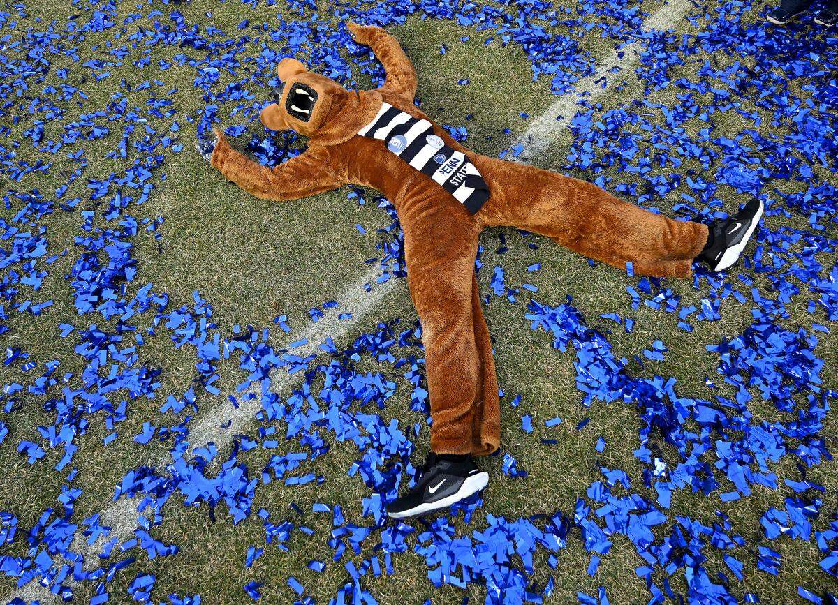 The Penn State Nittany Lion lays in the confetti after the win over Clemson in the Pinstripe Bowl at Yankee Stadium on Saturday, Dec. 27, 2025.