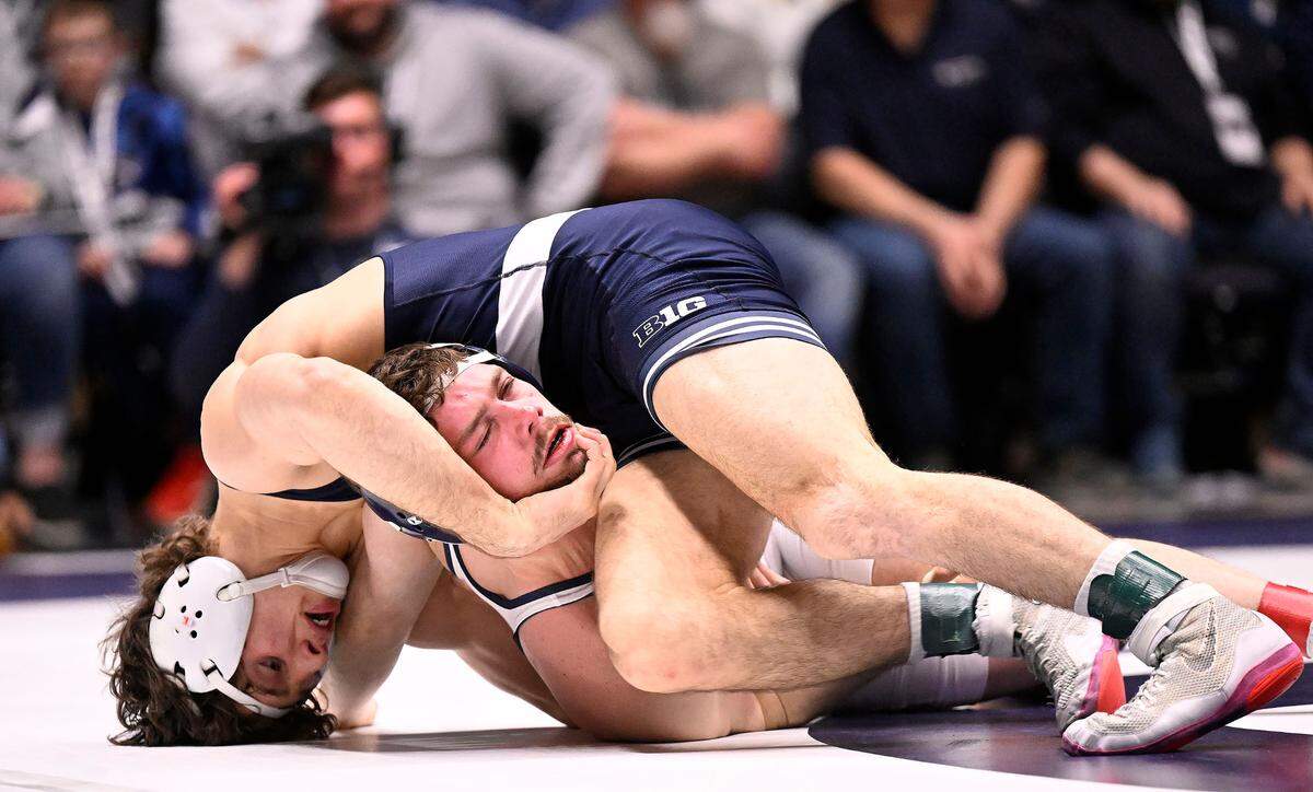 Penn State’s Levi Haines (top) scores a near-fall against Clarion’s Trevor Elfvin en route to a tech fall (18-3) at 149 pounds Sunday, Feb. 19, 2023, at Rec Hall.