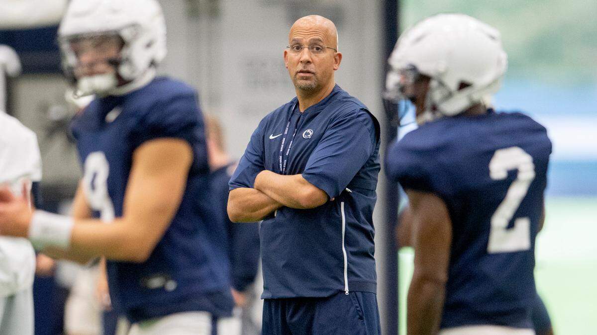 Penn State football coach James Franklin watches backup quarterbacks Christian Veilleux and Ta’Quan Roberson during practice on Wednesday, Sept. 22, 2021 in Holuba Hall.