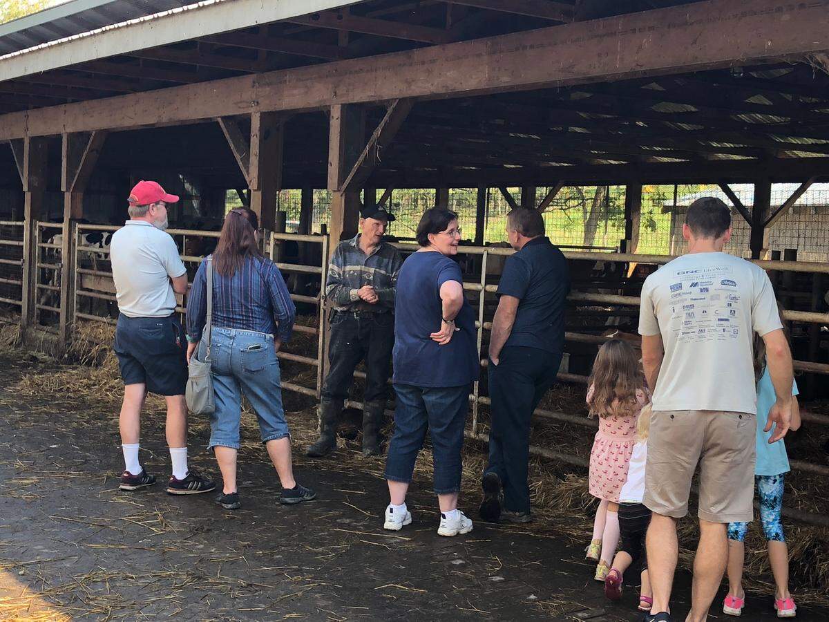 Dairy farmer Jeff Biddle shows people around Bear Meadow Farms in Boalsburg as part of the Centre County Farm Tour.