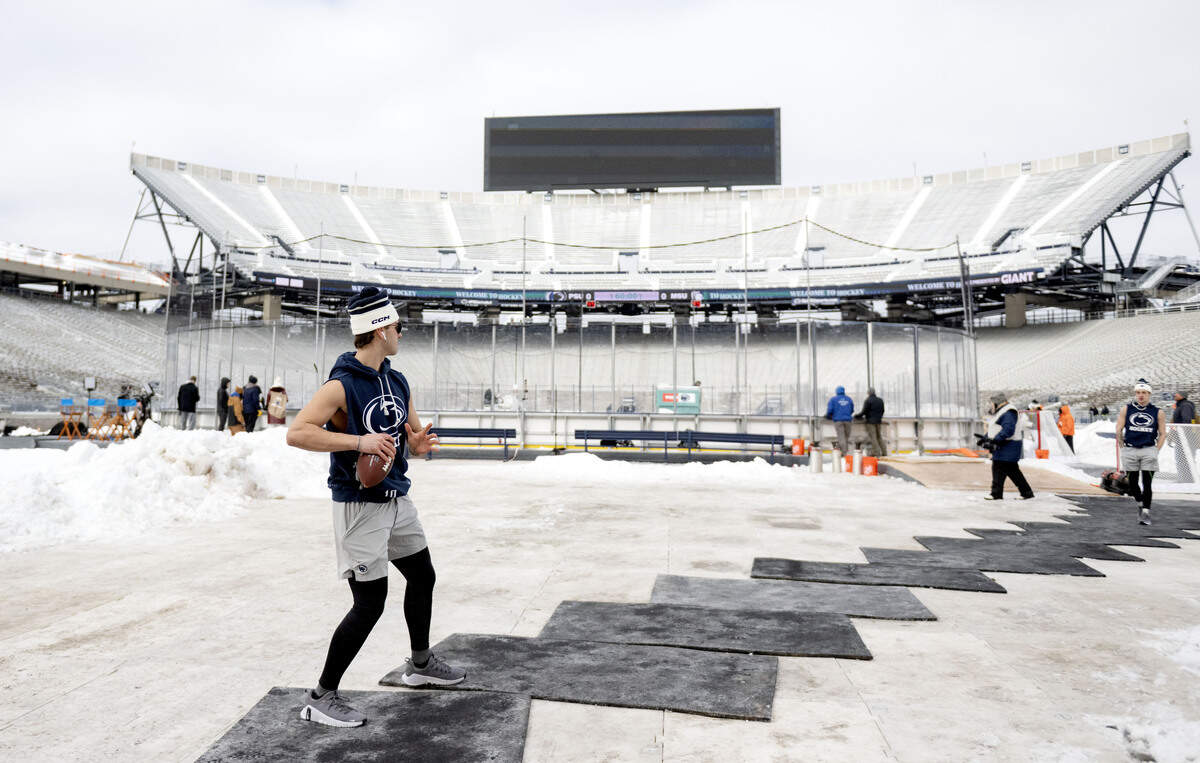 Penn State men’s hockey players toss a football around before the game against Michigan State at Beaver Stadium on Saturday, Jan. 31, 2026.