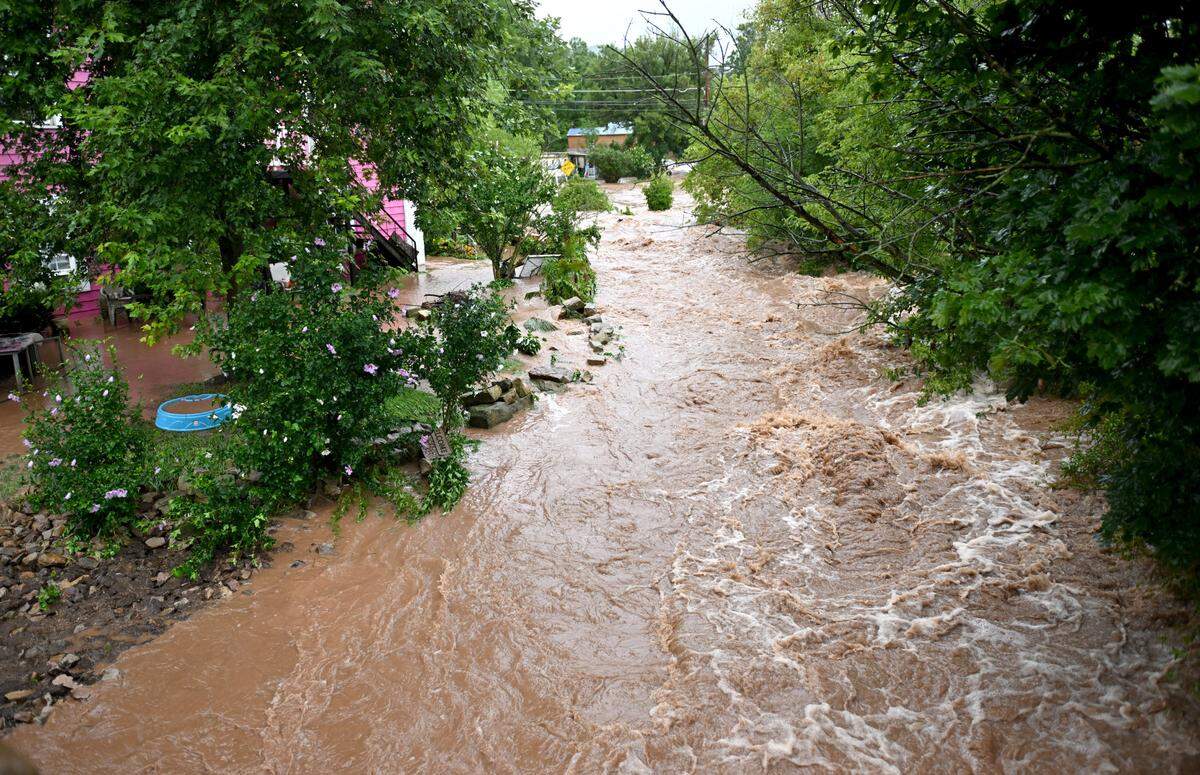 Dewitt Run overflows its banks and floods several homes in Unionville on Friday, August. 9, 2024.