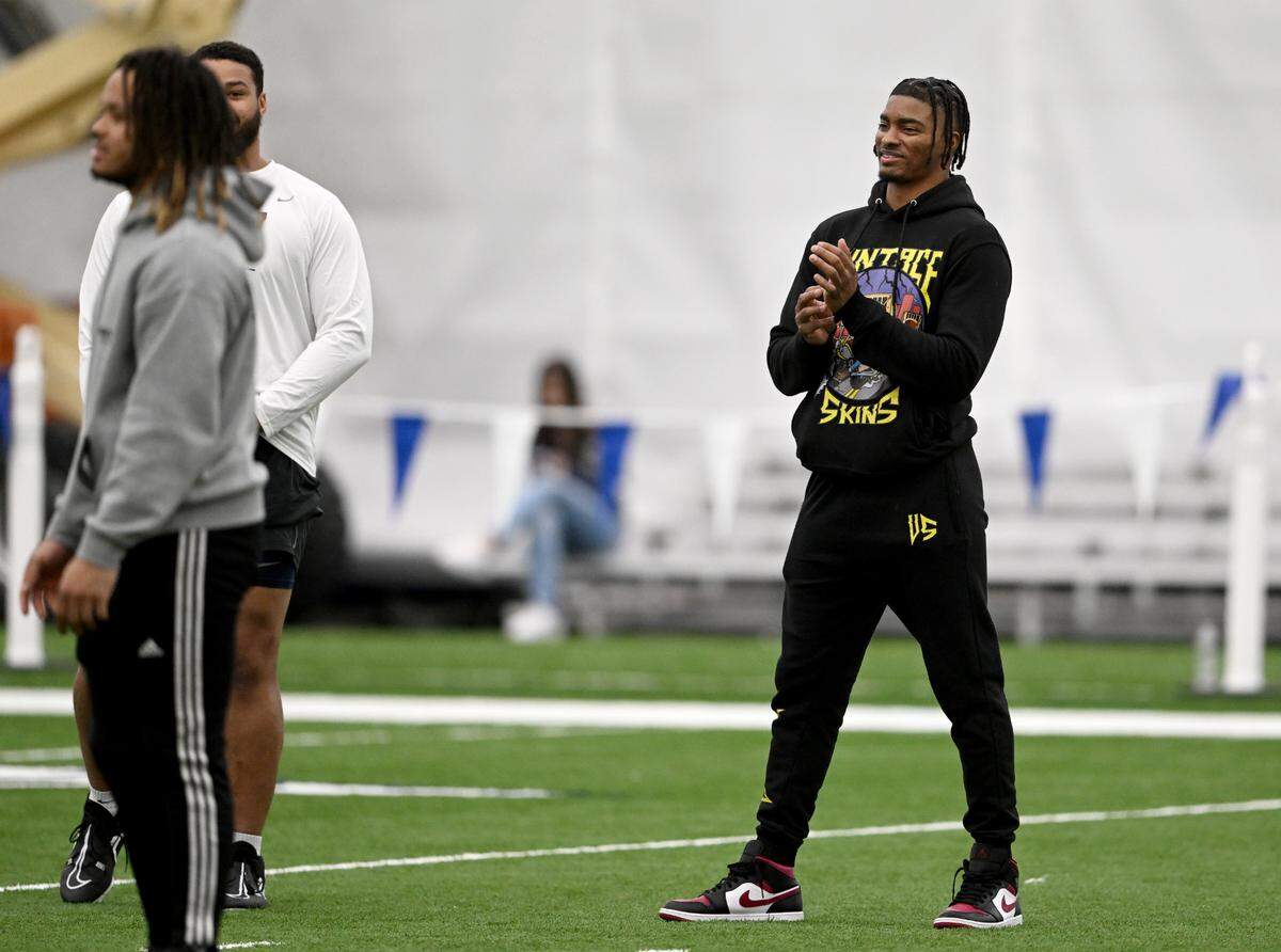 Chicago Bears’ safety Jaquan Brisker laughs with former teammates during Penn State football’s Pro Day on Friday, March 24, 2023.
