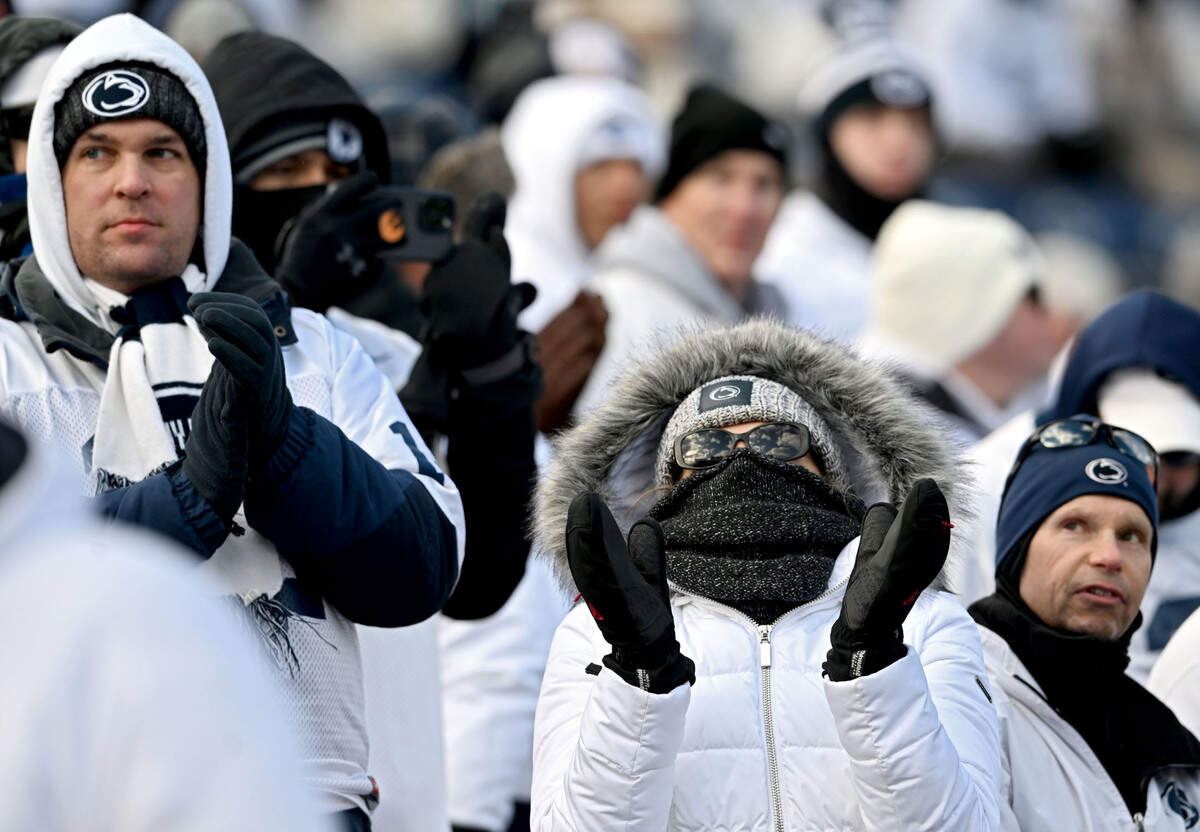 Penn State fans cheer as the football warms up for the CFP first round game against SMU on Saturday, Dec. 21, 2024 at Beaver Stadium.