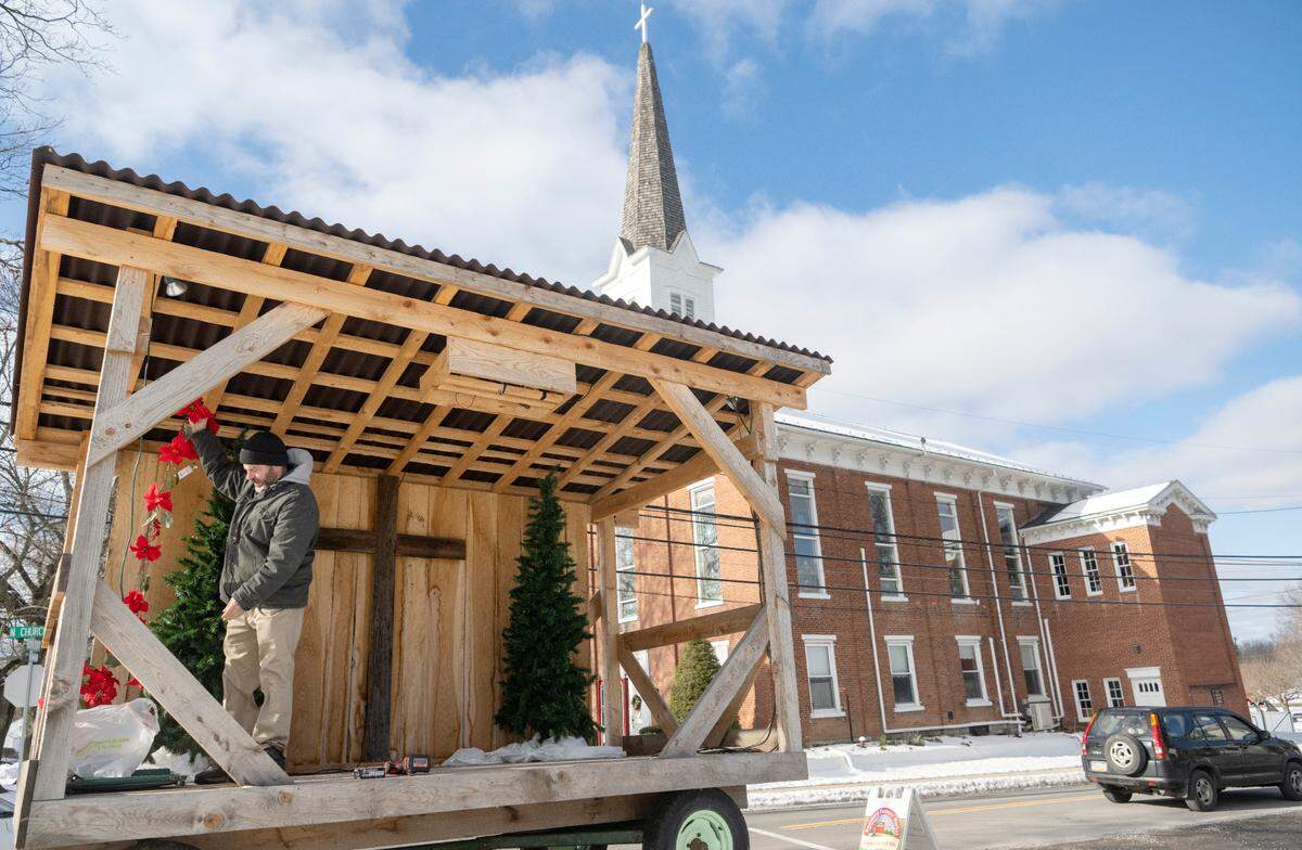 Pastor Brent Book of Zion Lutheran Church in Boalsburg prepares the worship wagon outside of the church for holiday services on Tuesday, Dec. 20 2022.