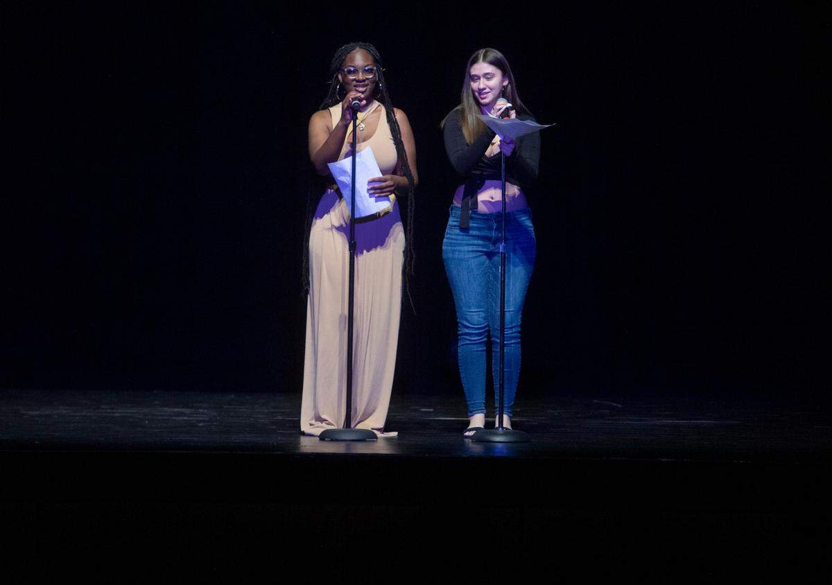 Sierra Mansaray and Zaniyah Acevedo welcome students to Lift Every Voice: A Cultural Celebration at State College Area High School on Friday, April 8, 2022.