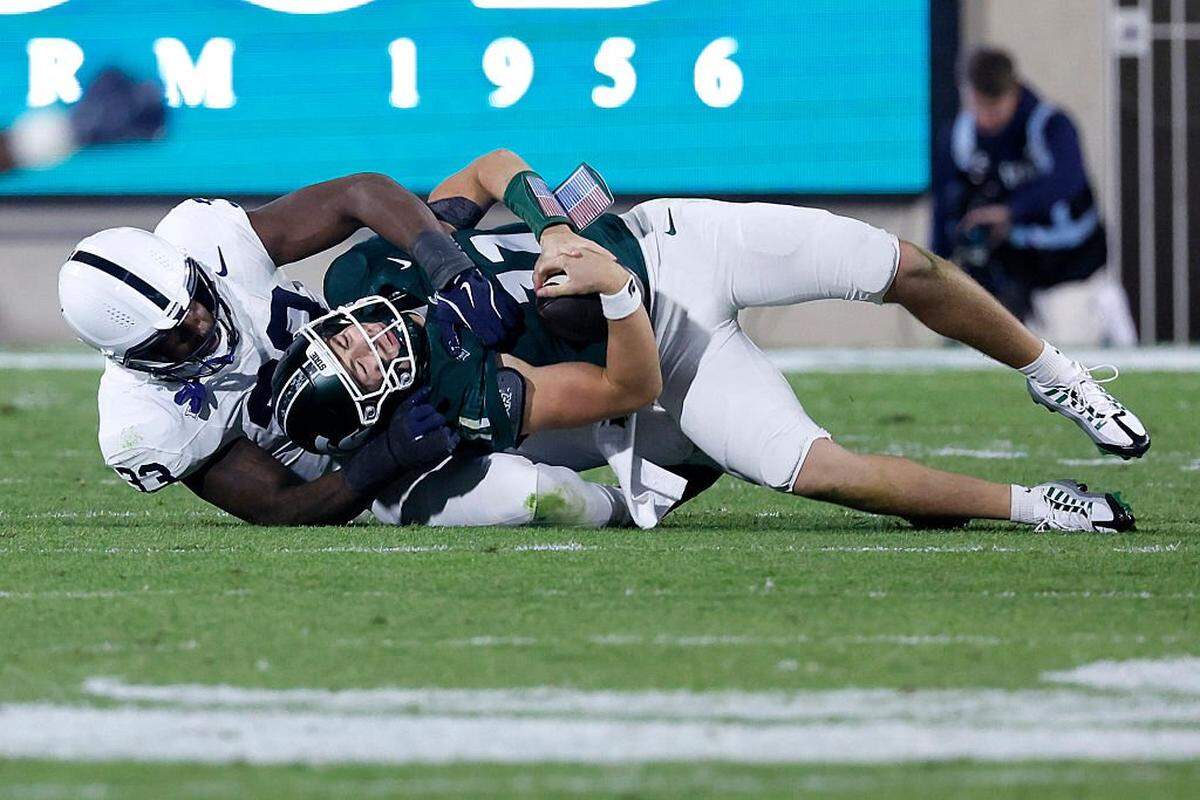 EAST LANSING, MICHIGAN -  NOVEMBER 15: Dani Dennis-Sutton #33 of the Penn State Nittany Lions sacks Alessio Milivojevic #11 of the Michigan State Spartans during the second half at Spartan Stadium on November 15, 2025 in East Lansing, Michigan. (Photo by Duane Burleson/Getty Images)