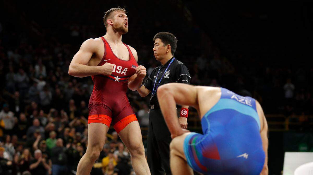 United States' David Taylor, left, celebrates after defeating Azerbaijan's Aleksander Gostiev, right, in their 86-kilogram match in the Freestyle Wrestling World Cup, Sunday, April 8, 2018, in Iowa City, Iowa.