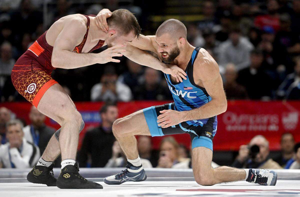 Spencer Lee and Thomas Gilman wrestle their first bout of the 57 kg challenge round at the U.S. Olympic Team Trials at the Bryce Jordan Center on Saturday, April 20, 2024. Lee won by decision, 6-3.