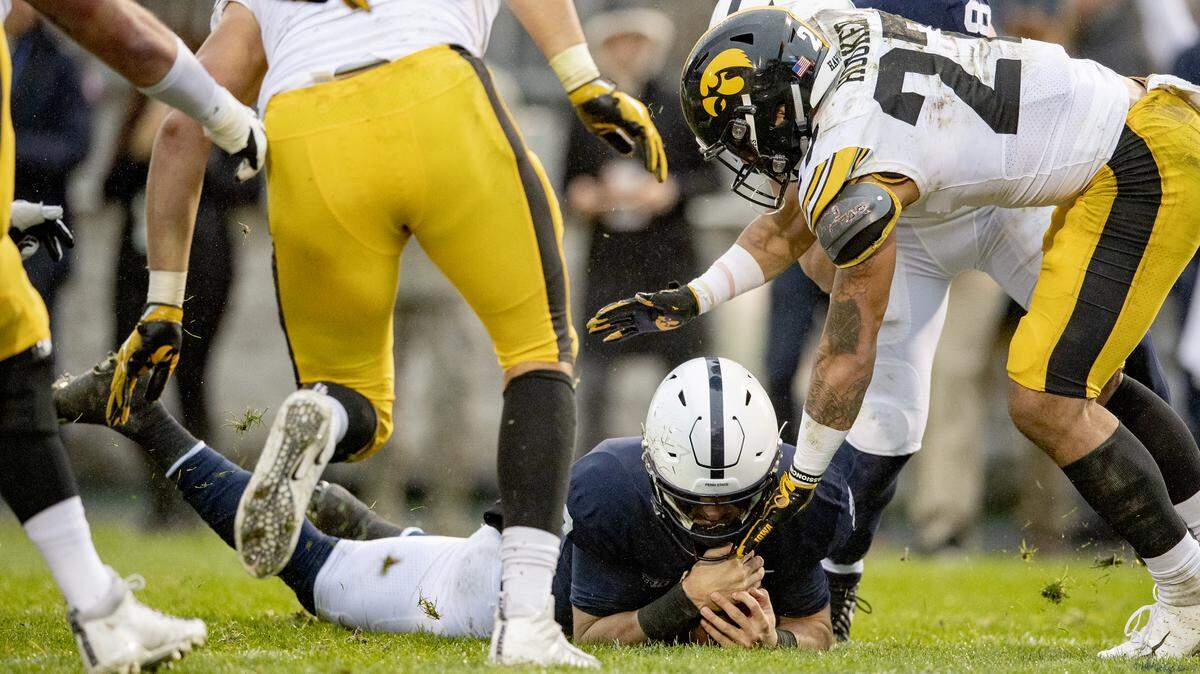 Penn State quarterback Tommy Stevens dives through Iowa defenders to score a touchdown during the second quarter of the game on Saturday, Oct. 27, 2018.
