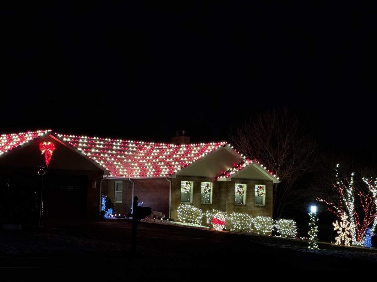 The entire roof of 668 N. Harrison Road, Pleasant Gap, is lit on Dec. 4, 2025.