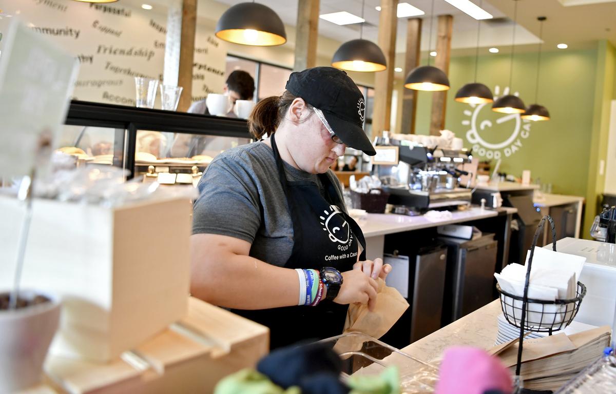 Anya Lazarow packages a baked good for an order at Good Day Cafe on Aug. 8.