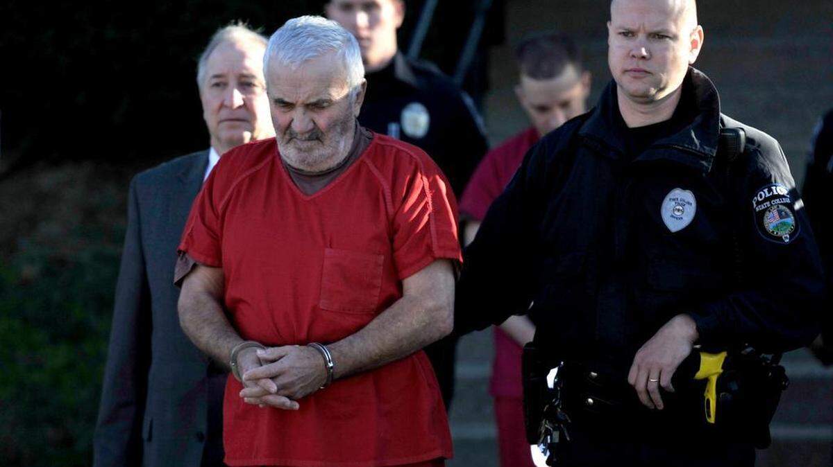 Vladimir Podnebennyy is taken into the Centre County Courthouse for his preliminary hearing on murder charges Wednesday. 
