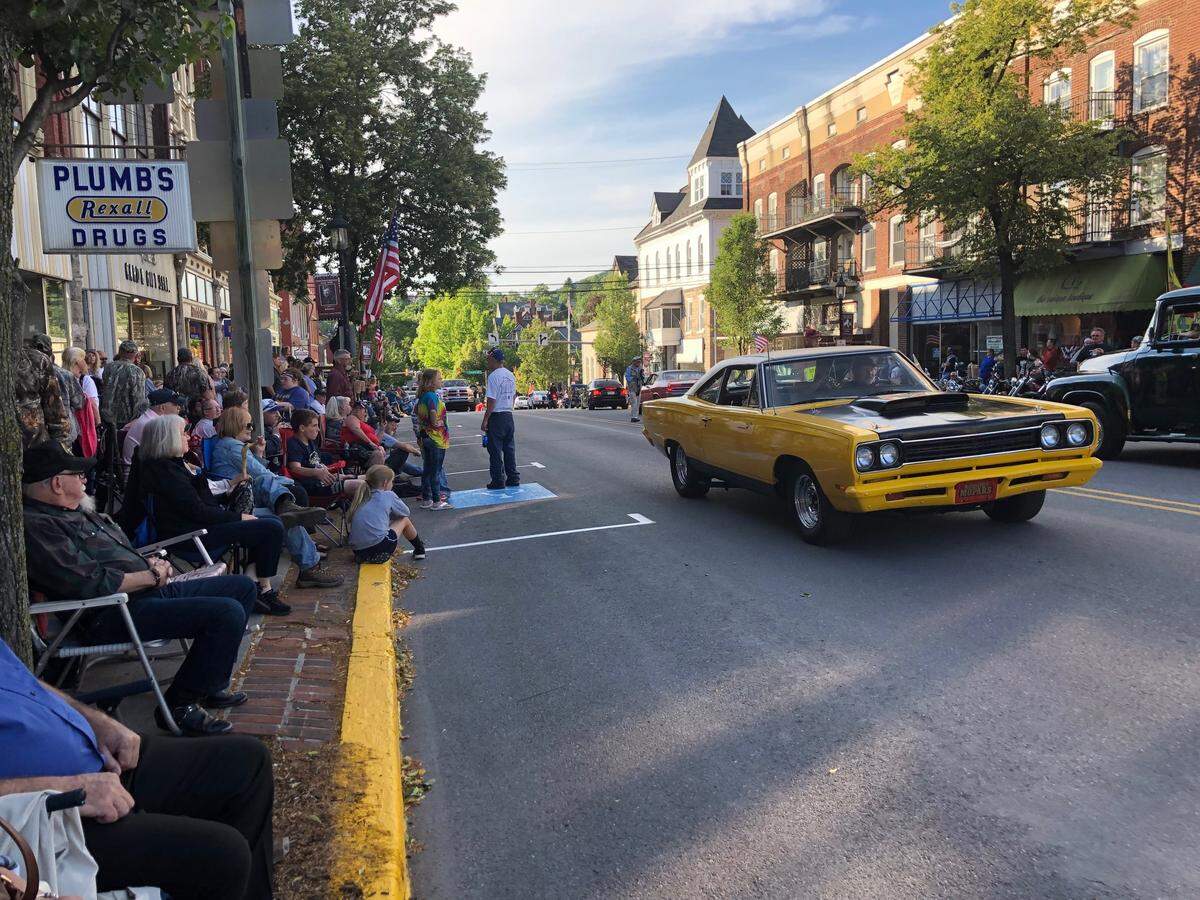 People watch cars drive by on South Allegheny Street during the Historic Bellefonte Cruise in June.
