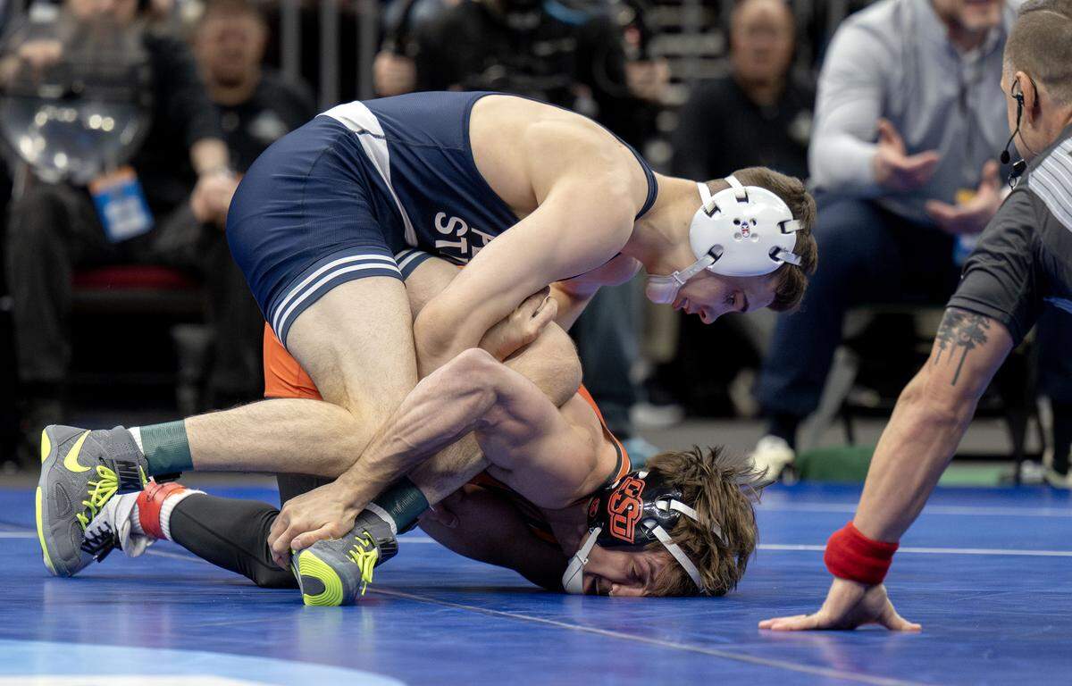Penn State's Luke Lilledahl controls Oklahoma State’s Troy Spratley in a 125-pound semifinal bout of the NCAA wrestling championships on Friday, March 20, 2026.