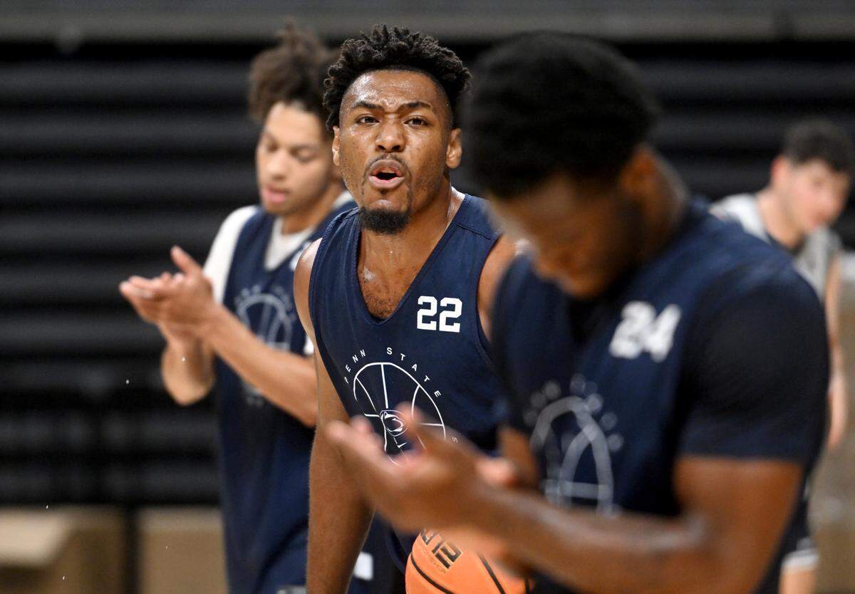 Penn State’s Jalen Pickett congratulates his teammates during summer practice on Tuesday, July 19, 2022.