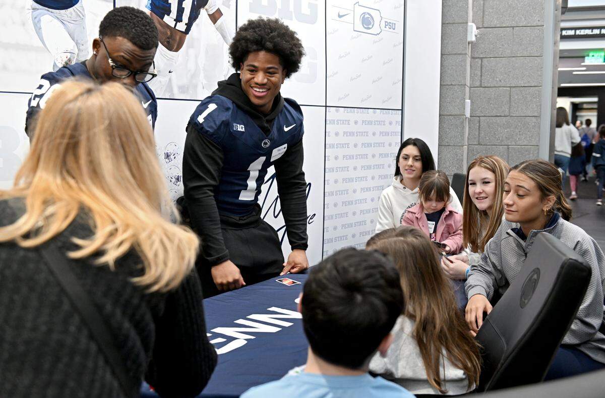 Penn State football player James Peoples laughs as he plays Uno with Four Diamonds families on Saturday, Feb. 21, 2026 in the Lasch Building. 