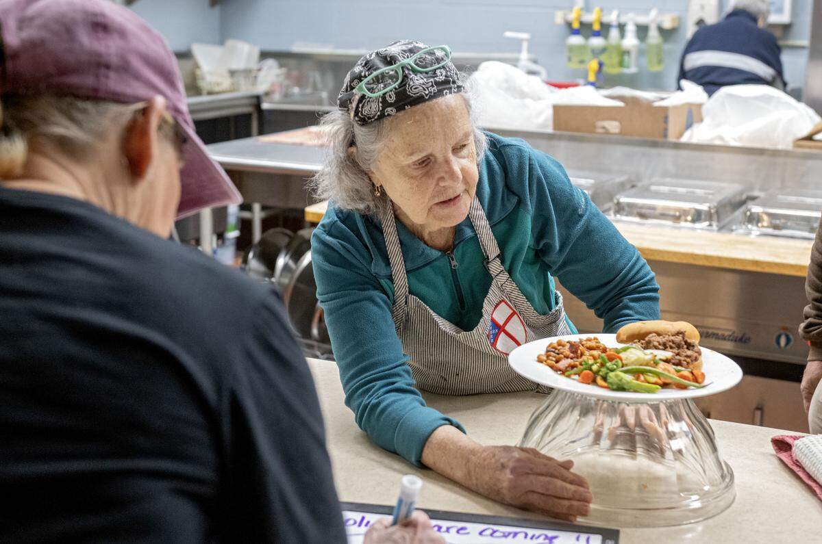 Grace Pilato shows a full plate of the Community Cafe meal at St. Andrew’s Episcopal Church on Thursday, Nov. 20, 2025.