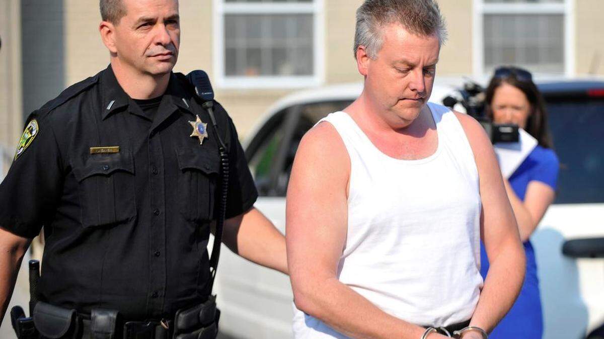 Alois Kudlach is escorted out of the Centre County Courthouse after being charged with the murder of his wife, Nuria Kudlach, on Tuesday, Sept. 1, 2015. 
