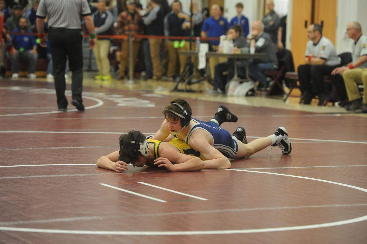Penns Valley’s Justin Darlington controls Forest Hills’ Isaiah Shilcosky during their 106-pound quarterfinals match of the District 6 Class 2A Championships on Friday, Feb. 18, 2022 in Altoona. Darlington need a takedown in sudden victory to secure a 6-4 win.