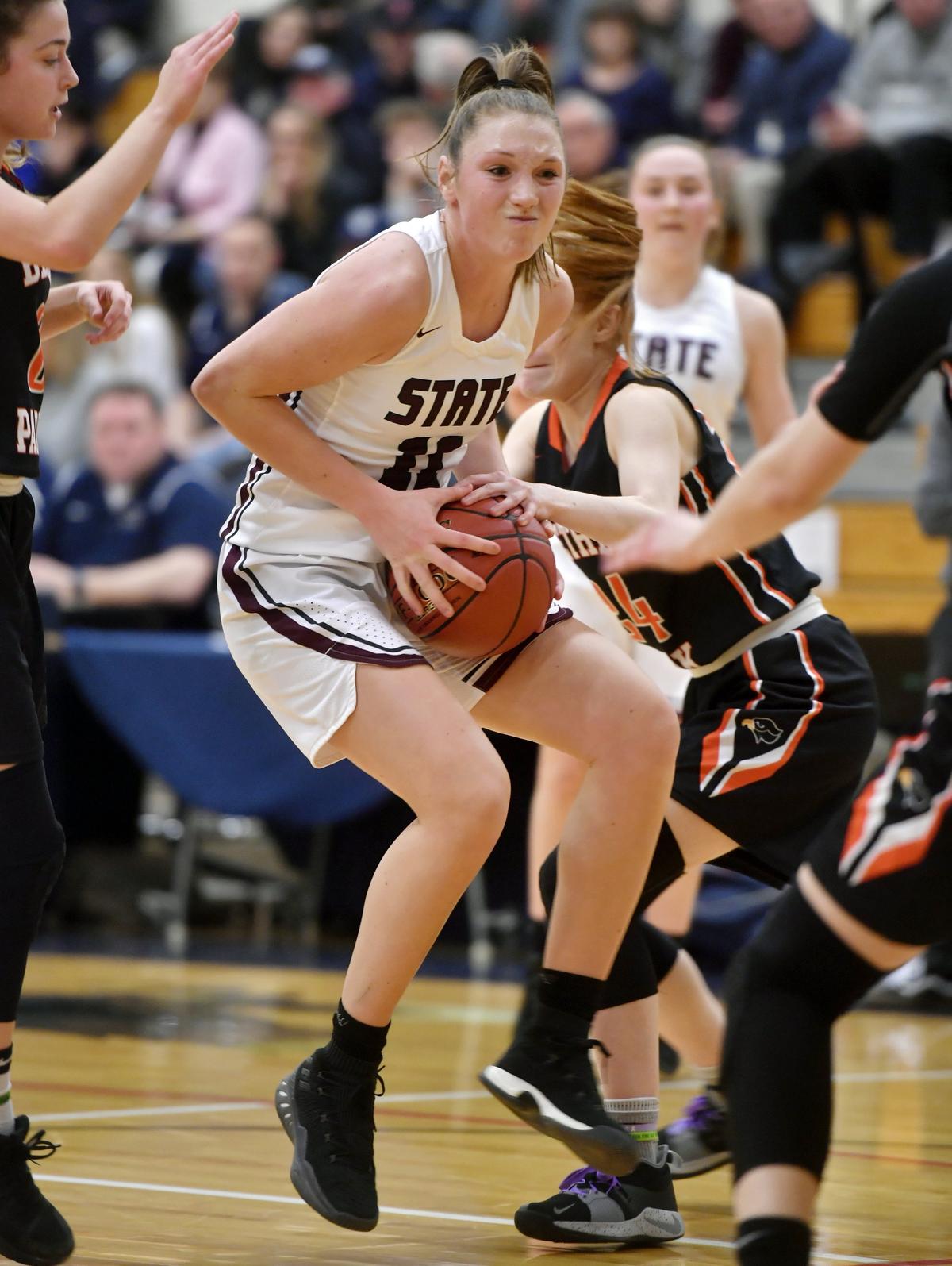 State College’s Maya Bokunewicz tries to fight through Bethel Park defenders during the game on Friday, March 8, 2019.