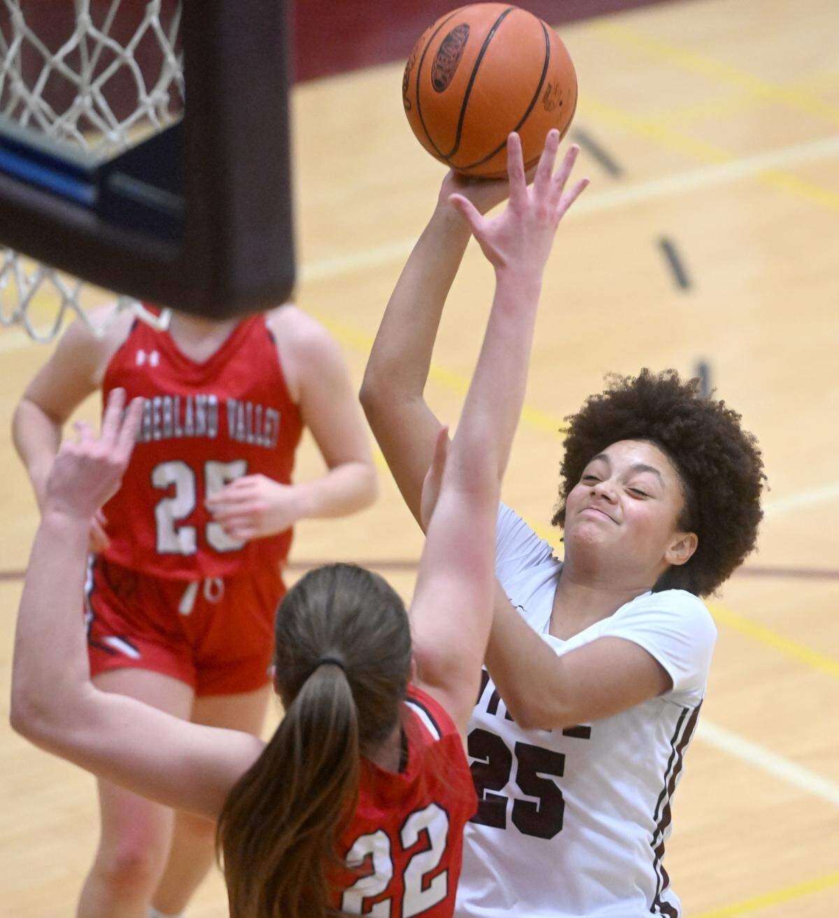 State College’s Lydia Tate shoots for a basket over Cumberland Valley’s Jill Jekot during the game on Tuesday, Jan, 24, 2023.