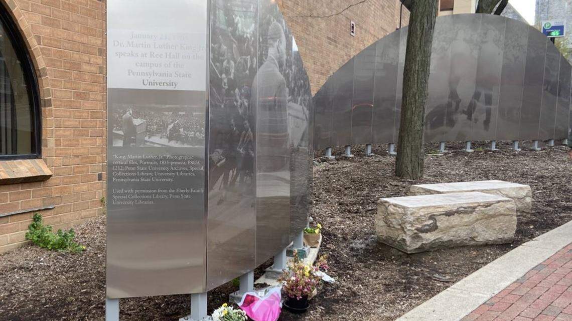 Community members left flowers in April at the Martin Luther King Jr. mural in State College, where a “Unite Against Hate” peace vigil was held.