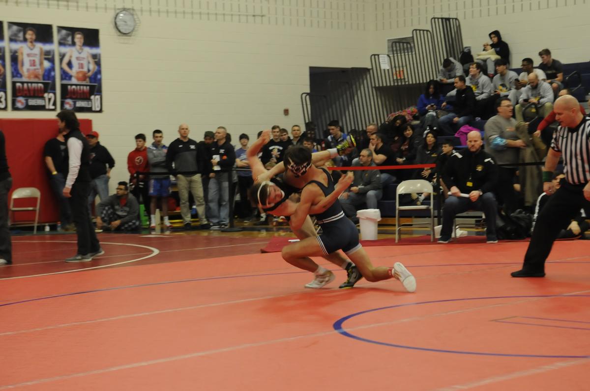 Philipsburg-Osceola’s Chase Chapman finishes off a throw of Lake Lehman’s Bob Long in their 132-pound quarterfinals match of the Ultimate Warrior Tournament at West Branch High School in Allport on Friday, January 25, 2019. Chapman topped Long 13-4.