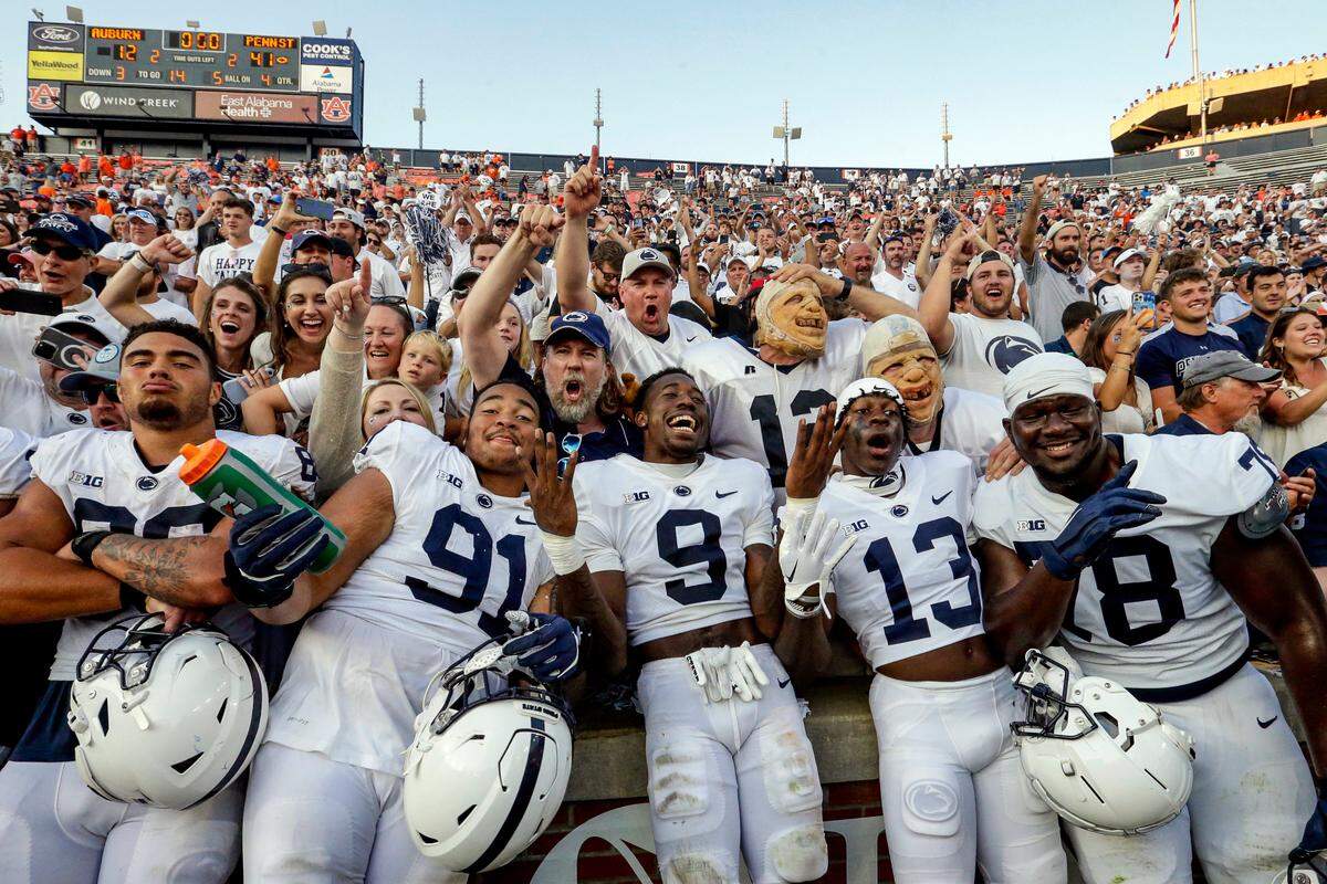 Penn State players and fans celebrate the victory over Auburn after an NCAA college football game, Saturday, Sept. 17, 2022, in Auburn, Ala.