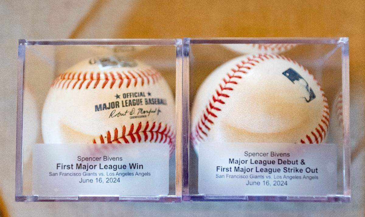 Two baseballs from Spencer Bivens’ first MLB win and first MLB strikeout.