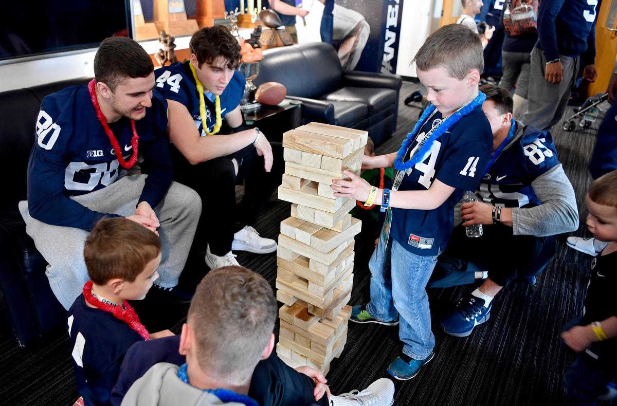 Penn State football players and Four Diamond families join together for a games in the Lasch Building on Saturday, Feb. 22, 2020.
