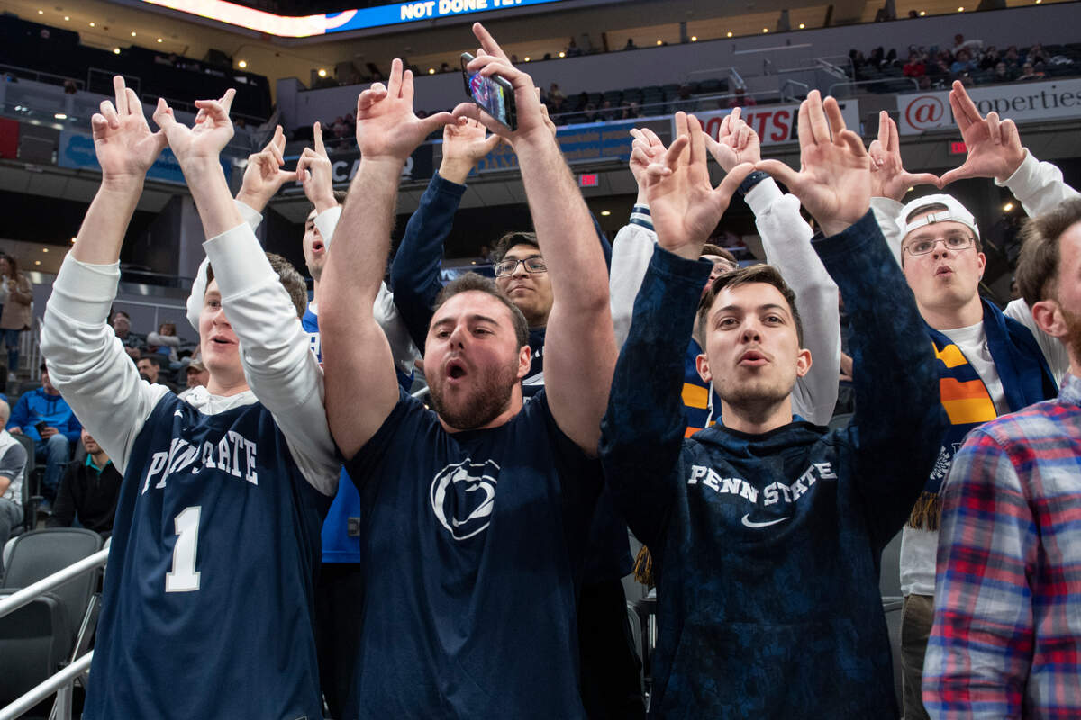 Legion of Blue, Penn State’s student section, puts up a “W” as Penn State guard Jalen Pickett (22) gets introduced during a Big Ten basketball tournament game between Penn State and Minnesota at Gainbridge Fieldhouse on Wednesday, March 9, 2022 in Indianapolis, Ind.