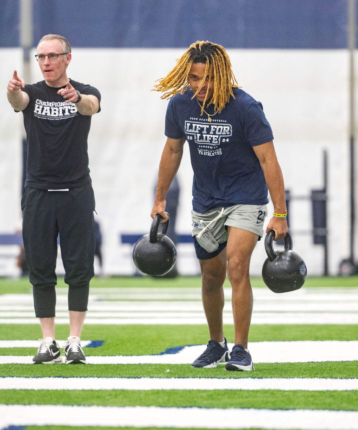 Penn State cornerback Antoine Belgrave-Shorter competes in a kettle ball carry during the 21st Annual Lift for Life to benefit Uplifting Athletes on Thursday, June 13, 2024 in Holuba Hall.