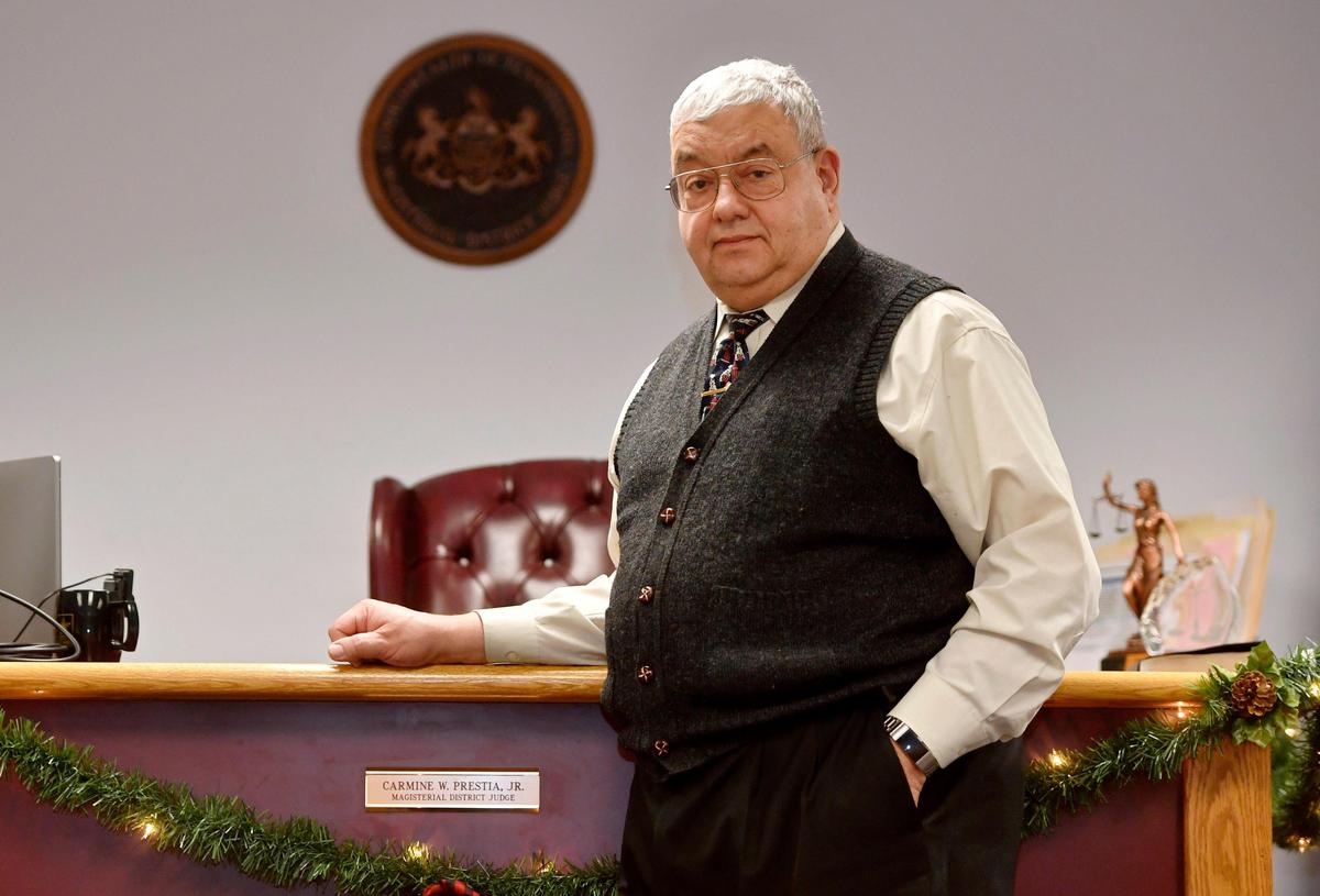 District Judge Carmine Prestia Jr. stands in the courtroom he is retiring from on Sunday after four terms as the district judge.